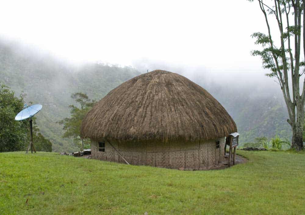 Satellite dish mounted outside in a remote area